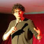 Simon Amstell performing comedy